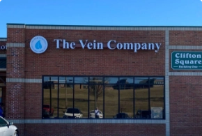 Exterior front view of The Vein Company medical clinic in Abingdon, featuring brick architecture and prominent building signage.