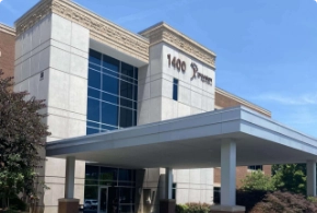 The exterior entrance of The Vein Company's Knoxville clinic, featuring professional building signage and modern brick architecture.