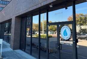 The exterior storefront of The Vein Company in Oak Ridge, featuring large glass windows and the company logo on the door.
