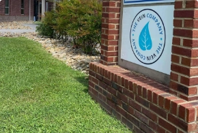 The exterior entrance of The Vein Company clinic in Sevierville, featuring professional building signage and brick architecture.